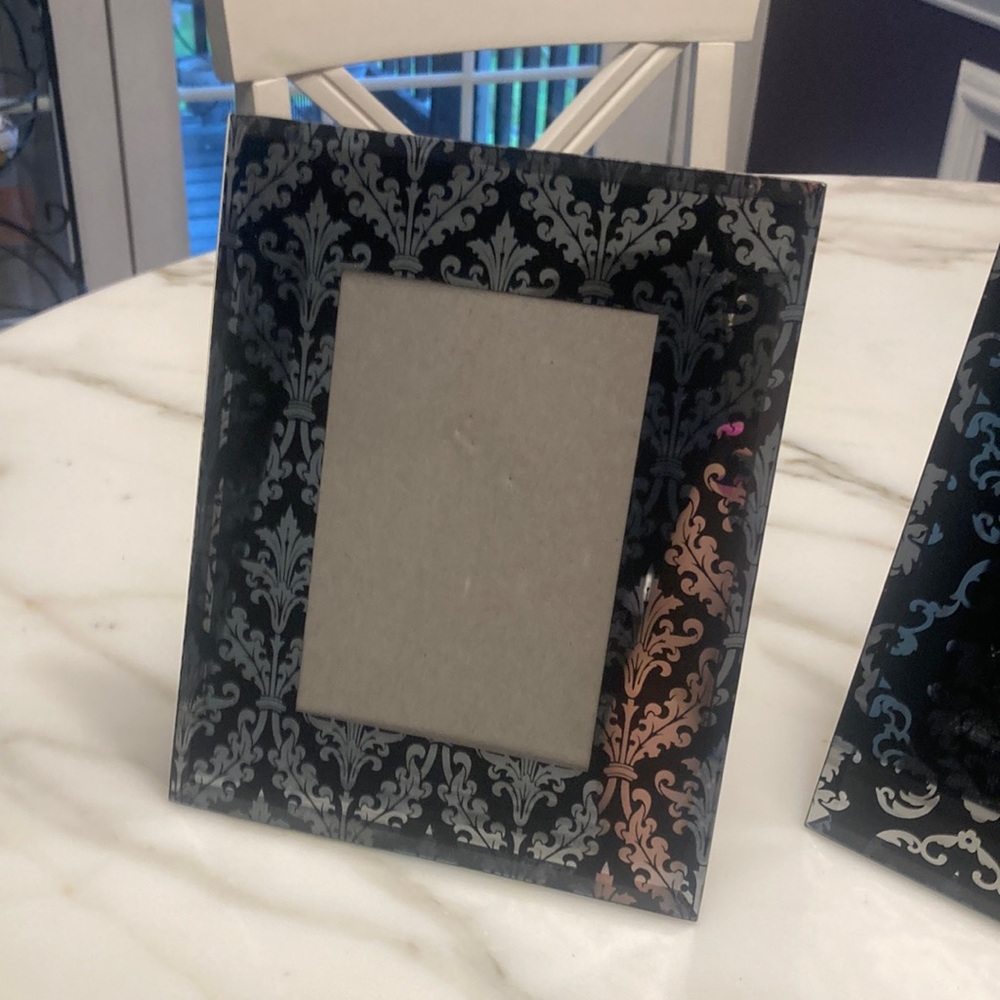 Two decorative picture frames.